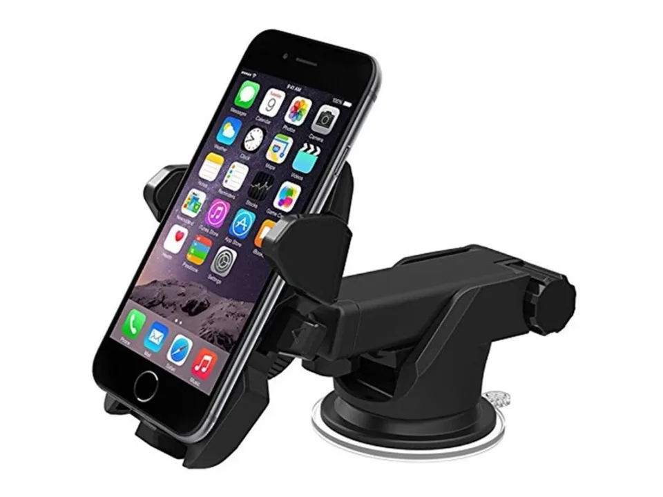 Car phone holder with a smartphone attached, isolated on white.