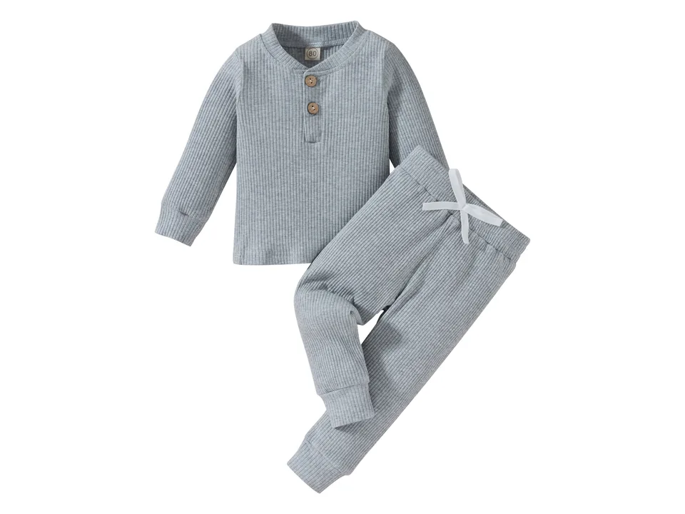 A grey ribbed long-sleeve top and matching pants set on a white background.