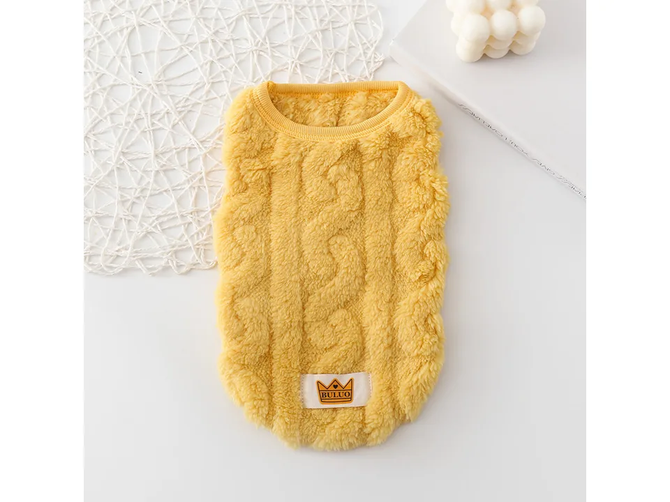A yellow cable-knit style fleece dog vest.