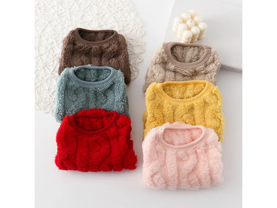 A collection of five dog vests in different colors: brown, beige, blue, yellow, red, and pink.