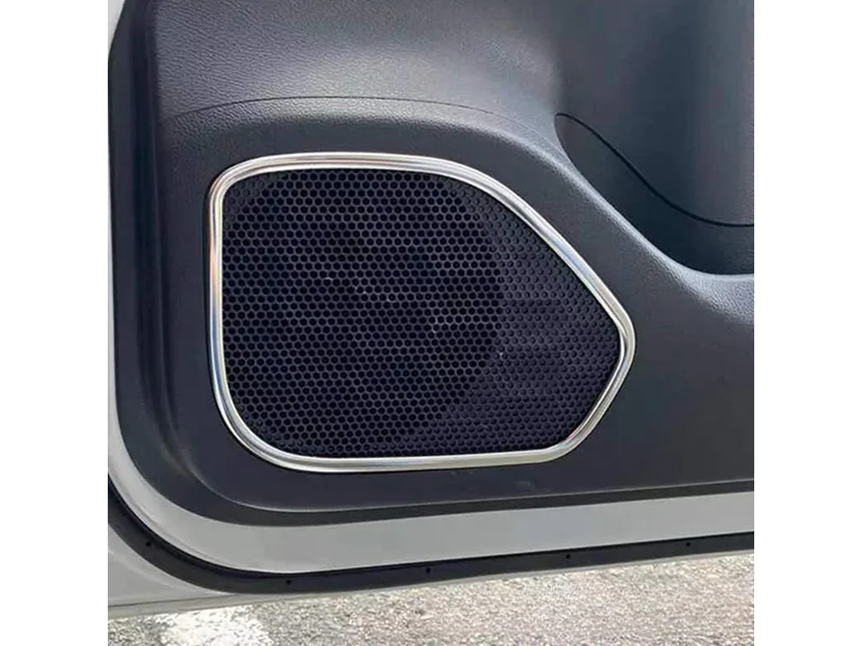 Chrome speaker trim installed on a car door speaker grille.