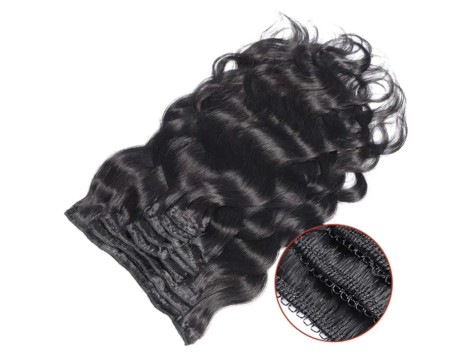 A bundle of wavy black hair extensions with a close-up circle showing the stitched weft.