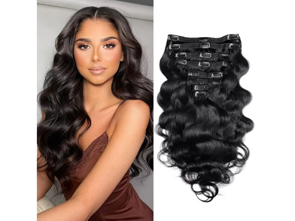 A model wearing long, wavy black hair extensions.