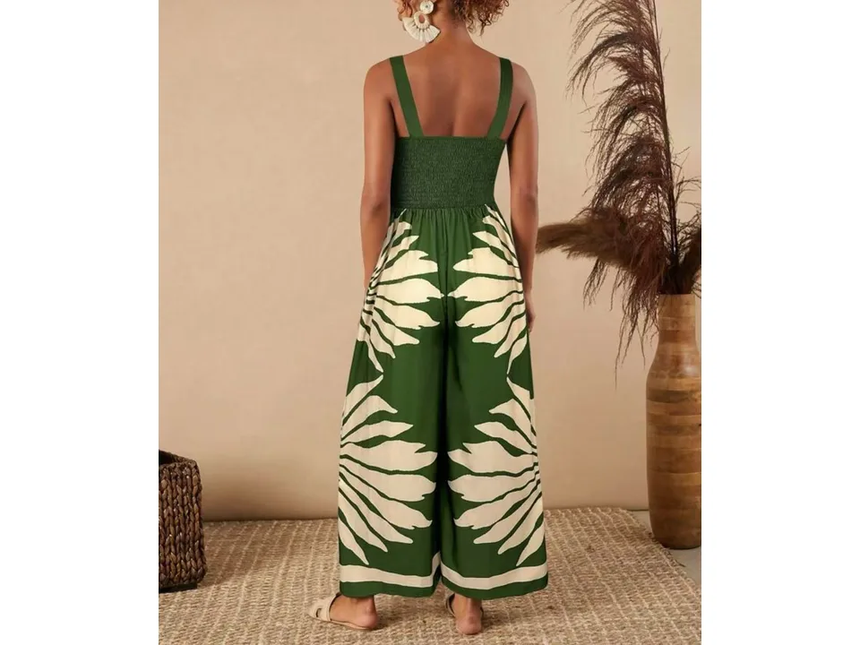 Back view of a model wearing a green and white printed wide-leg jumpsuit.