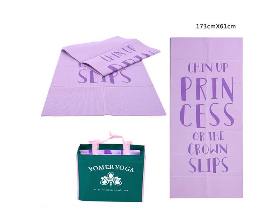 Purple foldable yoga mat with 'Chin up princess' text and a green carrying bag.