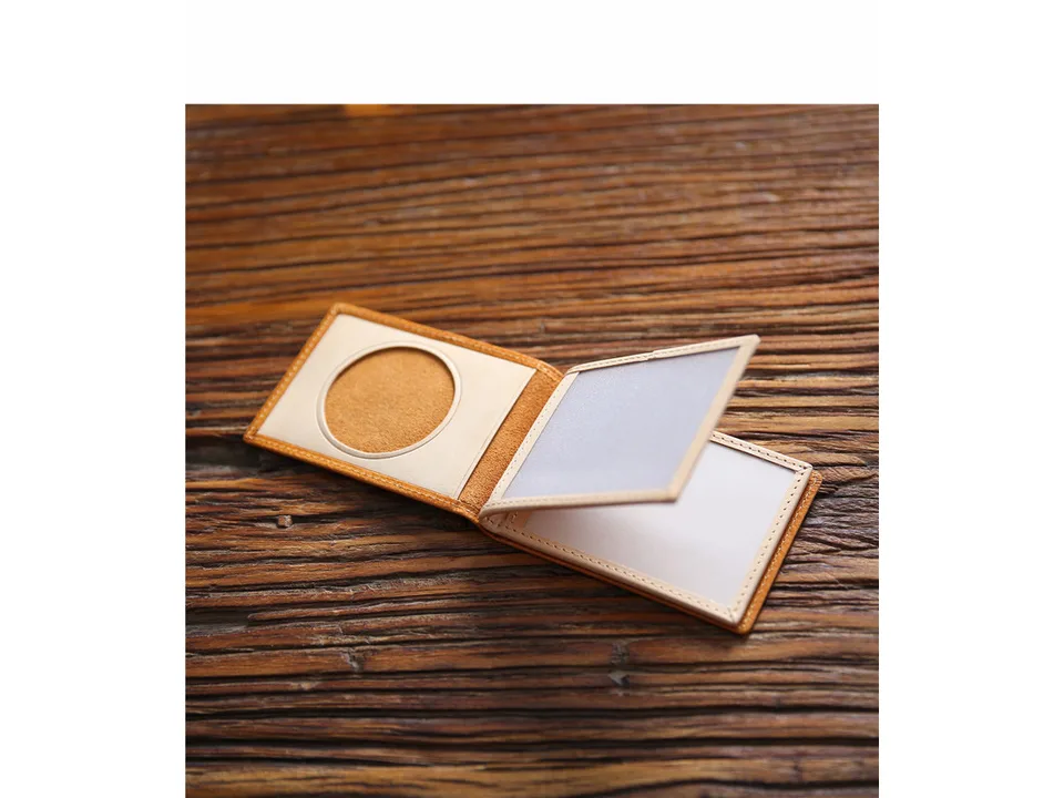 The open wallet showing interior card slots and a clear ID window.