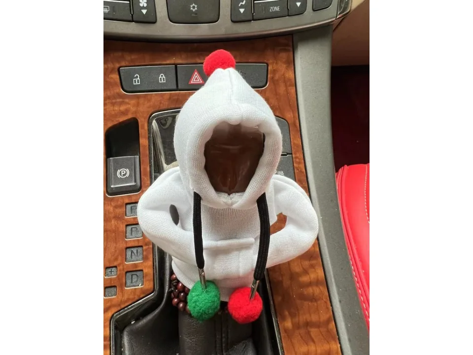 White hoodie cover on a car gear shift knob