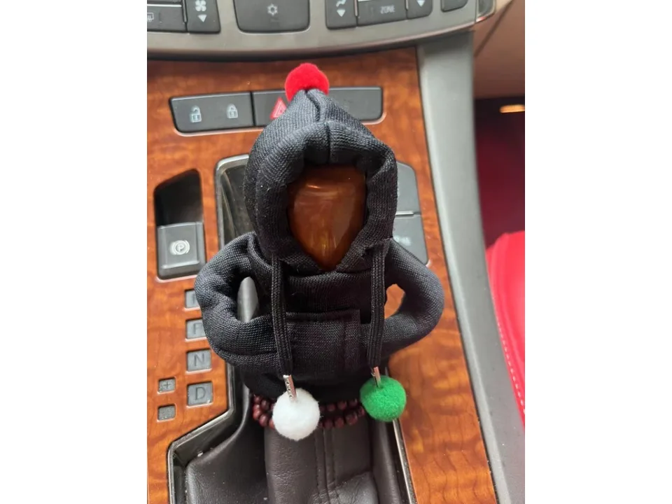 Black hoodie cover on a car gear shift knob