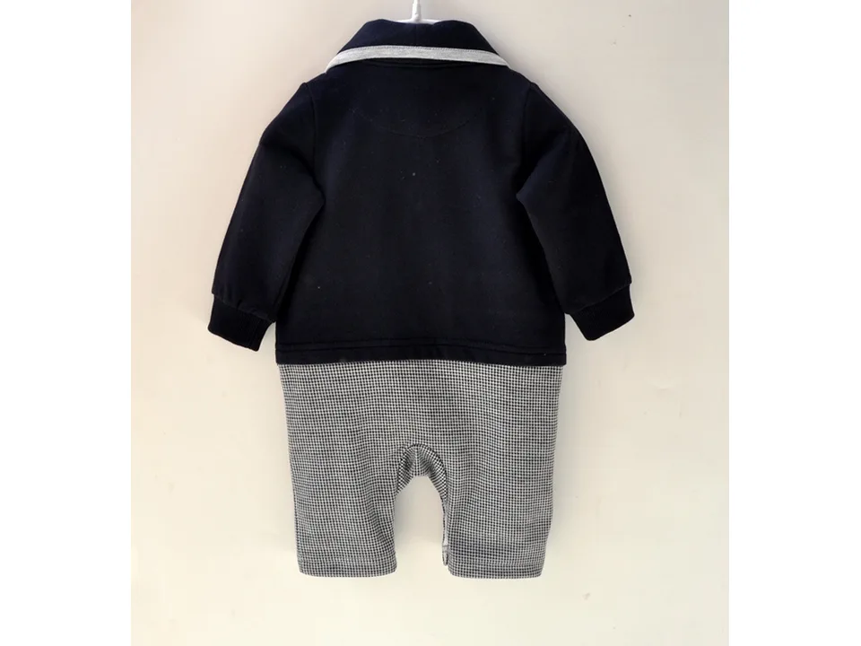 The back view of the baby boy formal jumpsuit showing the navy jacket and houndstooth pants.