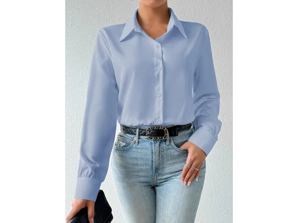 Light blue long sleeve button-down bodysuit worn with jeans and a belt