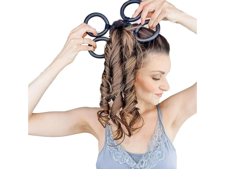 A woman wrapping her hair around the heat-free curling garland rings.