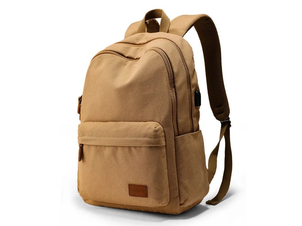Tan canvas backpack showing the side view with the USB charging port.