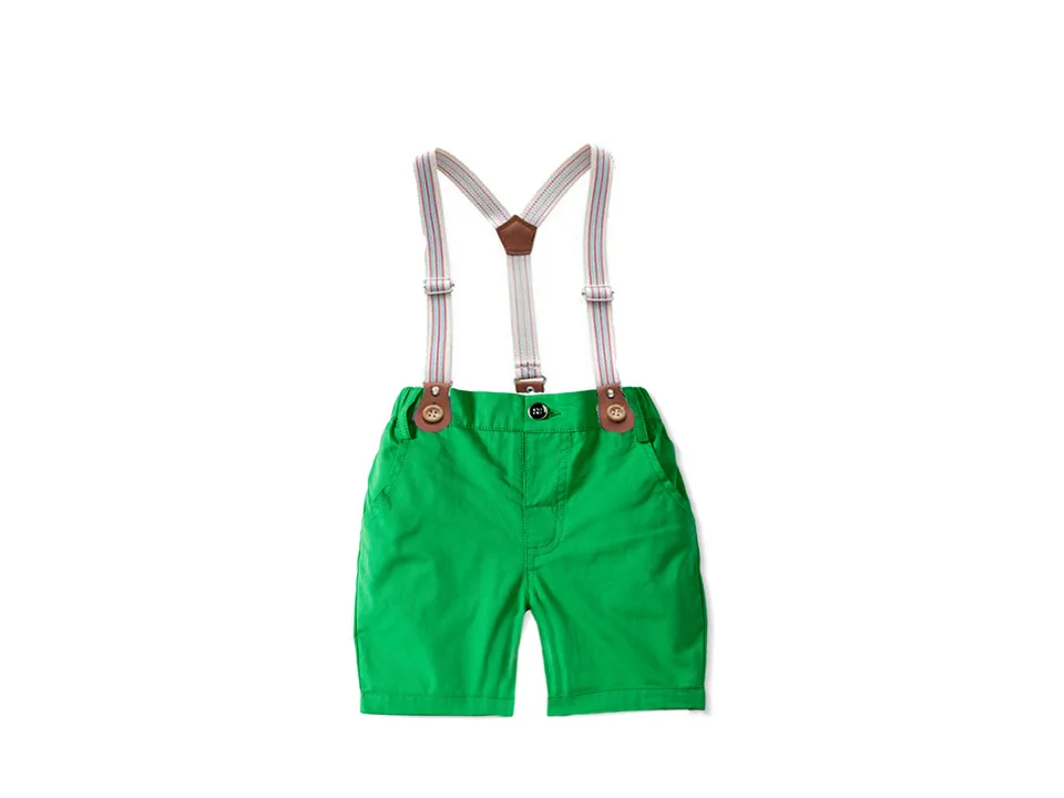 Green baby shorts with attached suspenders.