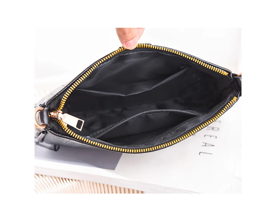 Interior view of the crossbody bag showing the lining and zippered pockets.