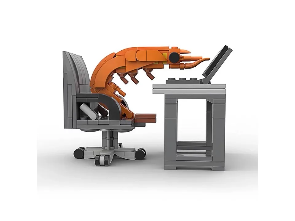 A side view of the shrimp building block set at a desk.
