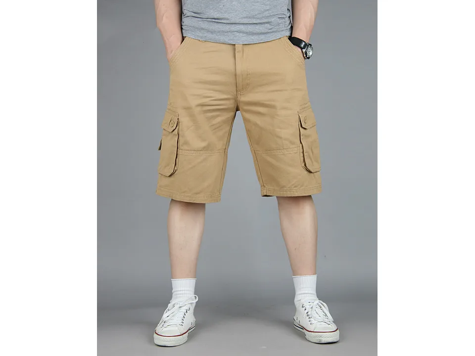A man wearing khaki cargo shorts with side pockets.