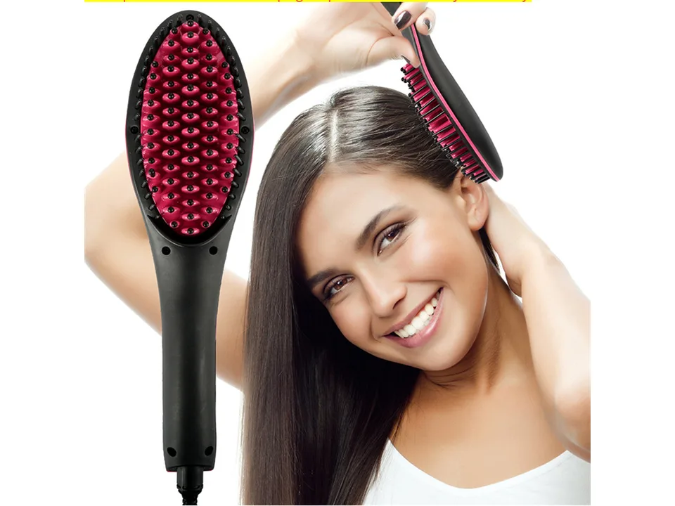 A woman smiling while using the electric hair straightening comb on her hair.