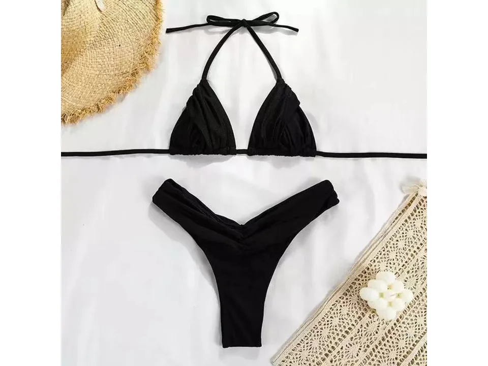 A black two-piece bikini set laid flat.