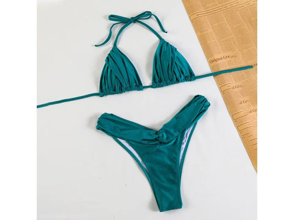 A teal green two-piece bikini set laid flat.