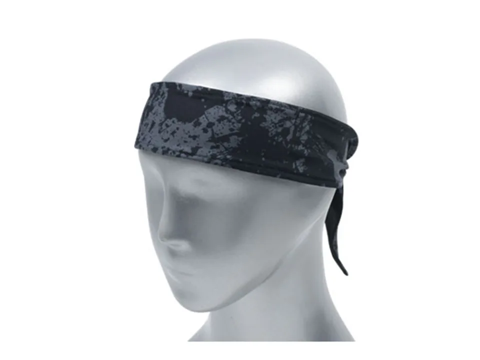 A black and grey splatter pattern sports headband worn on a mannequin head.