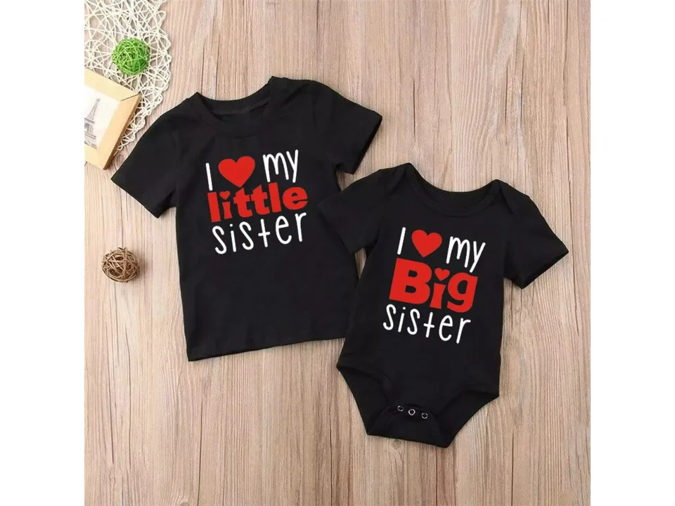 Black matching sister t-shirt and romper set with red heart text.