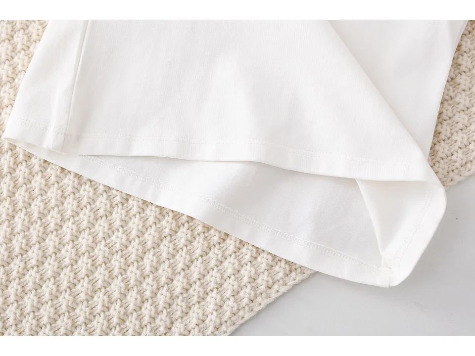 Close-up of the shirt hem and fabric.