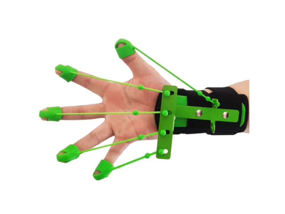 A hand wearing a green finger and wrist extensor trainer with fingers spread out.