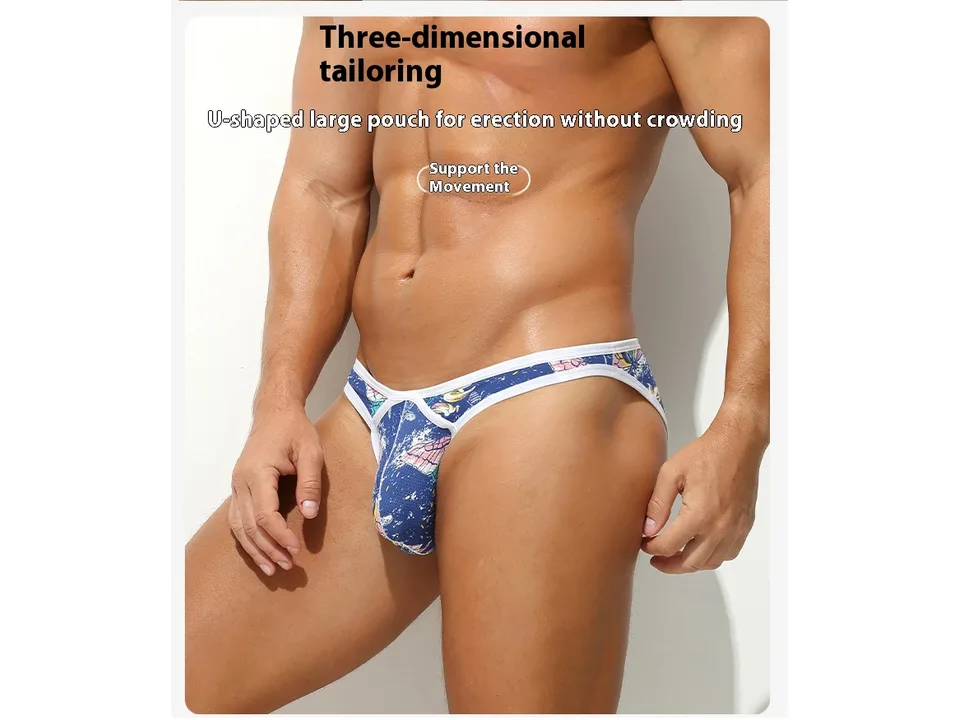 Front view of a man wearing printed low-waist thong underwear.