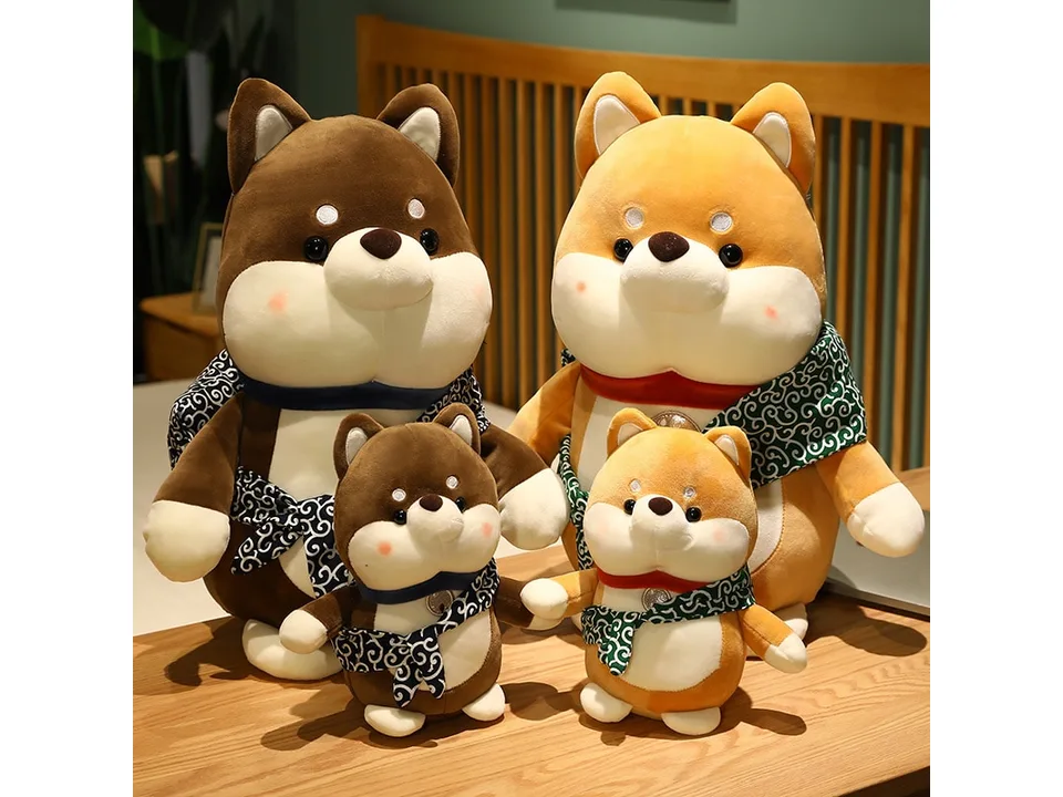 Two large and two small Shiba Inu plush toys displayed together.