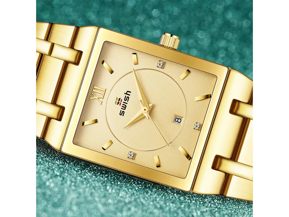 Close-up of the gold watch face showing the dial and hands.