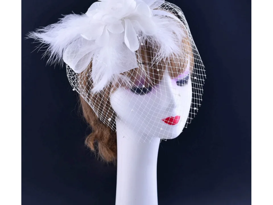 Side view of a bridal veil with flower headband on a mannequin
