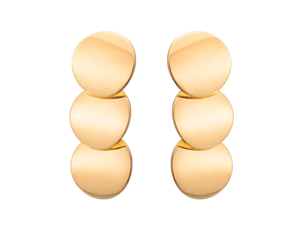 A pair of gold triple-circle drop earrings on a white background.
