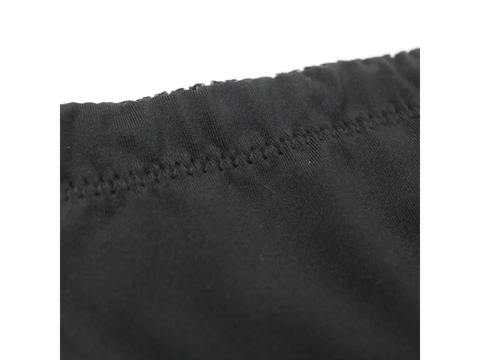 Close-up of the black fabric and stitching on the waistband of the shapewear shorts.