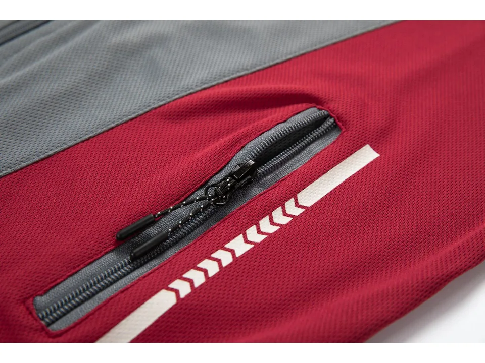 Close-up of the zipper pocket and fabric texture on the red sports top.