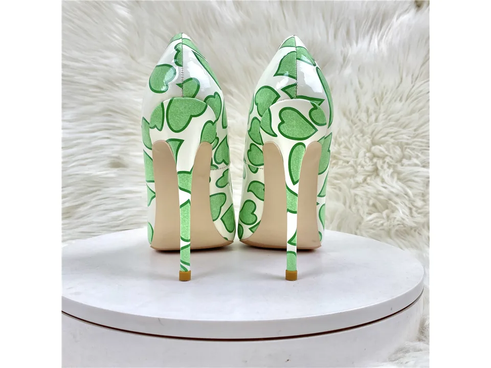 Rear view of the stiletto pumps showing the heel and heart pattern.