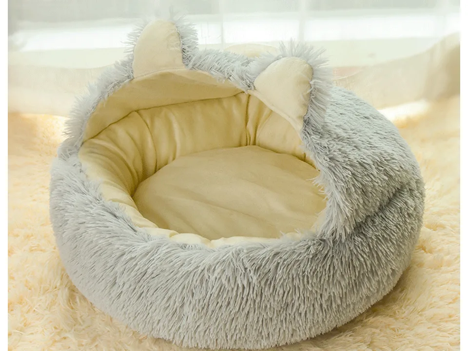 Grey plush pet bed with cat ear details.