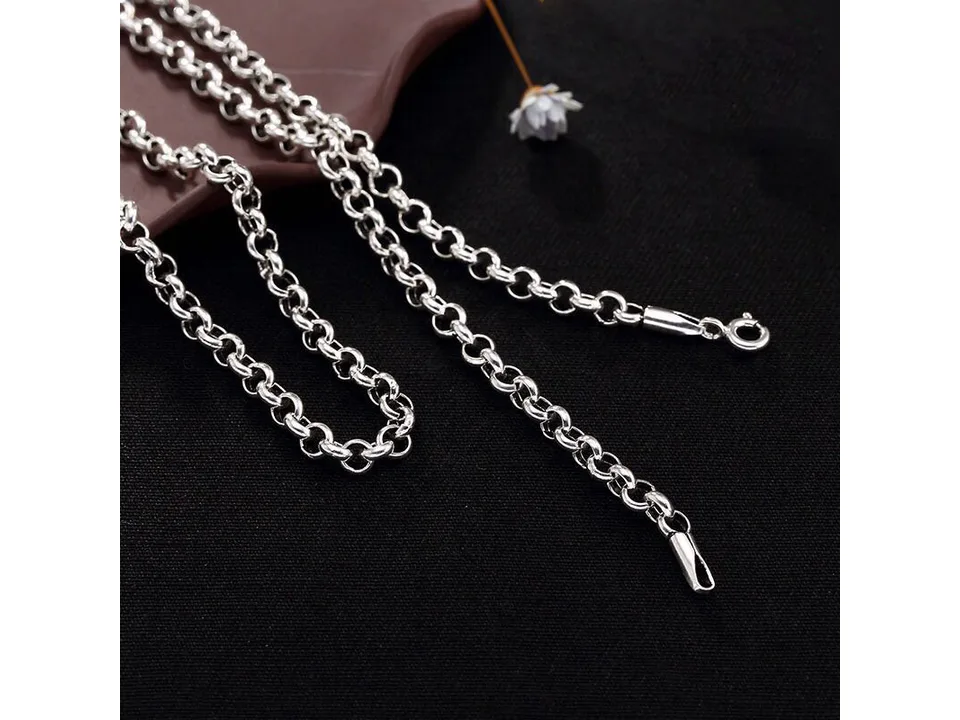Close-up of a silver chain necklace showing the links and clasp.