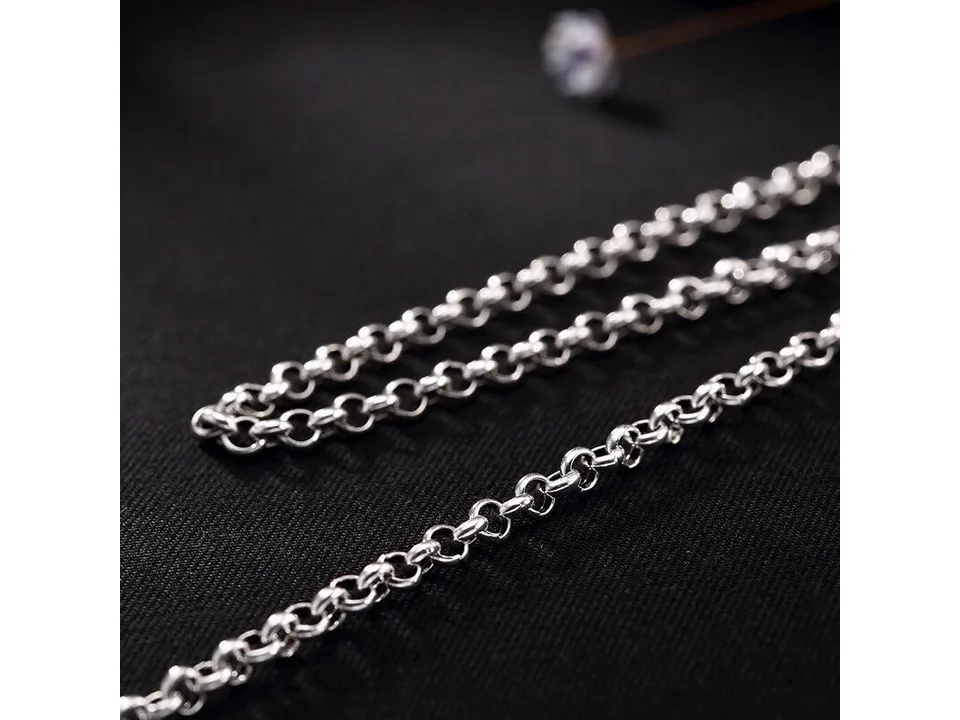 Detailed close-up of the silver chain links.
