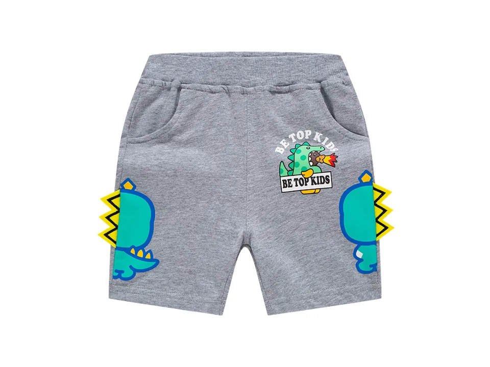 Grey boys' shorts with a dinosaur graphic and yellow spikes on the sides.