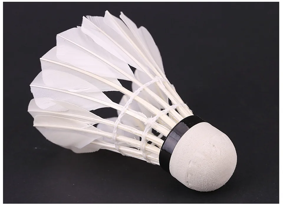 A single feather badminton shuttlecock close-up.