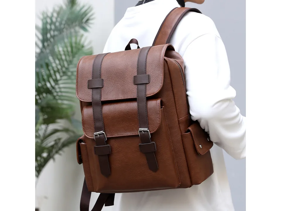 Person wearing a brown PU leather backpack