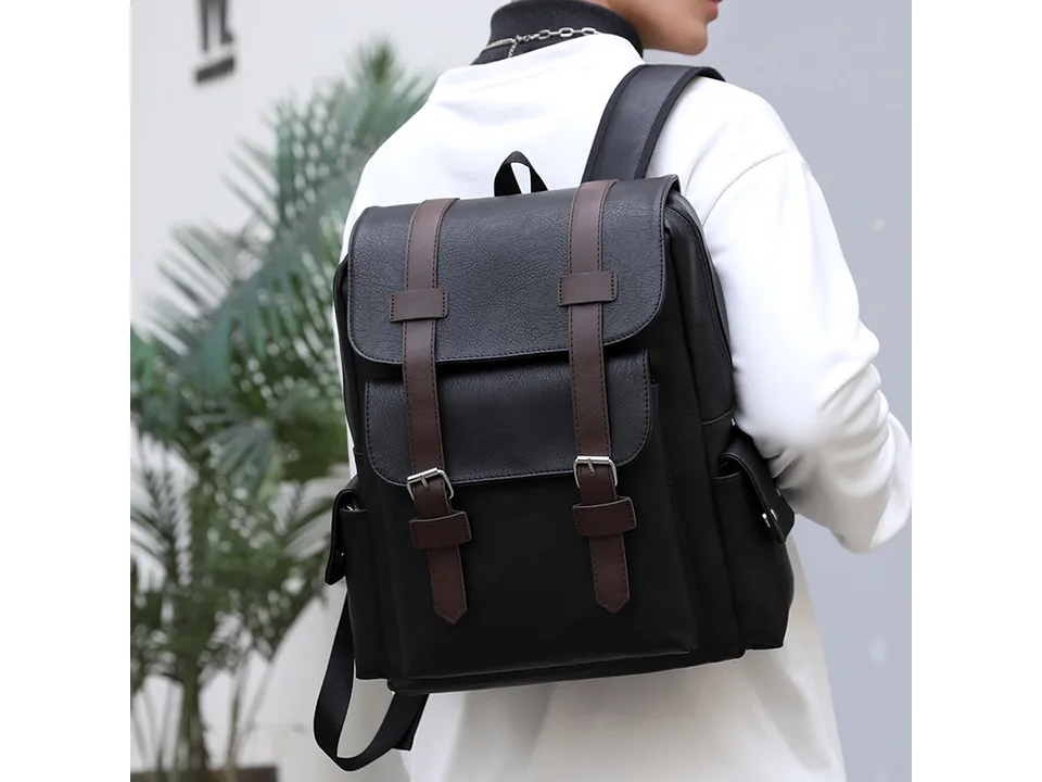 Person wearing a black PU leather backpack