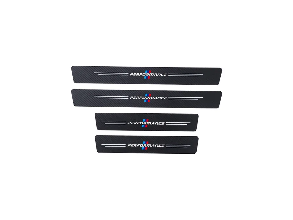 Four carbon fiber style door sill protector strips with Performance branding laid out on a white background.