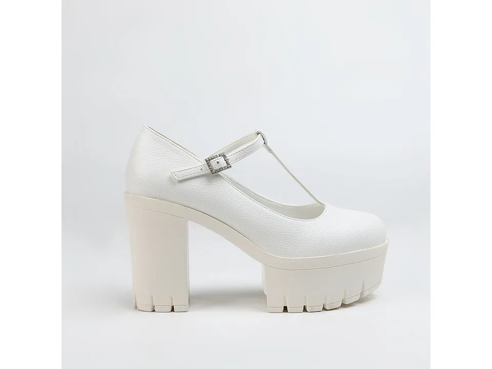 Side view of a white T-strap platform heel.