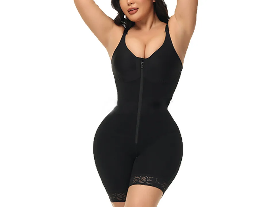 A woman wearing a black full-body shapewear bodysuit.