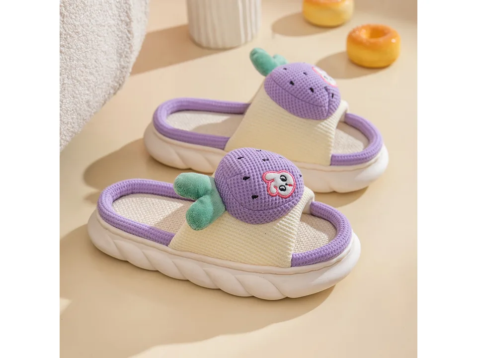 A pair of purple fruit-themed slippers with a thick sole and open toe.