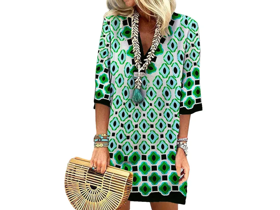 A woman wearing a geometric print V-neck mini dress with half sleeves.
