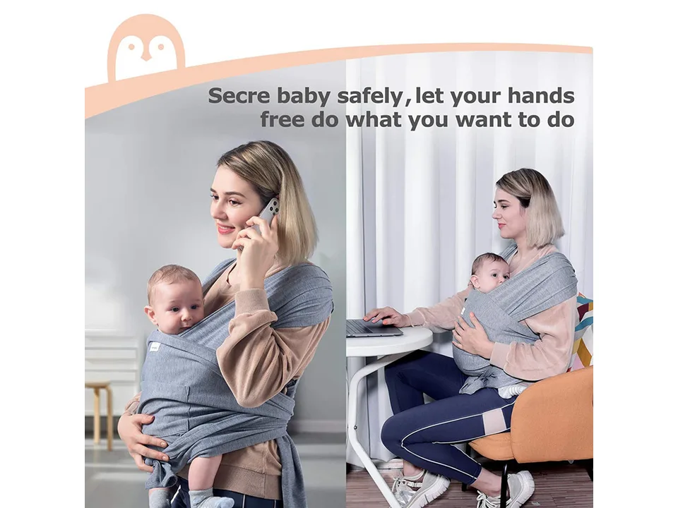 A woman using the baby sling while talking on the phone and working at a desk.