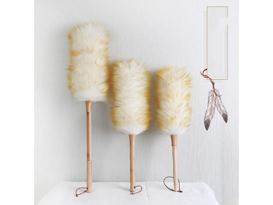 Three wool dusters of different lengths standing upright.