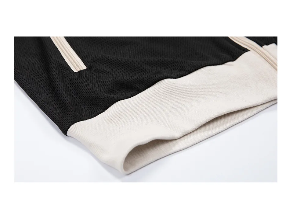 Close-up of the hem and fabric texture of the athletic top.